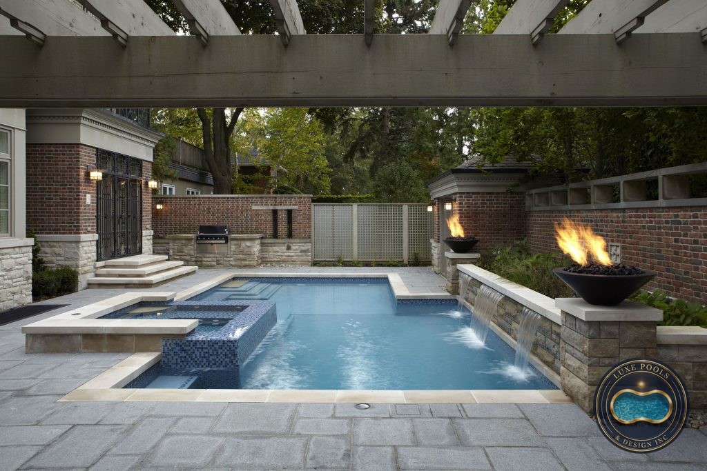 Fibreglass swimming pool with patio installed by Luxe Pools
