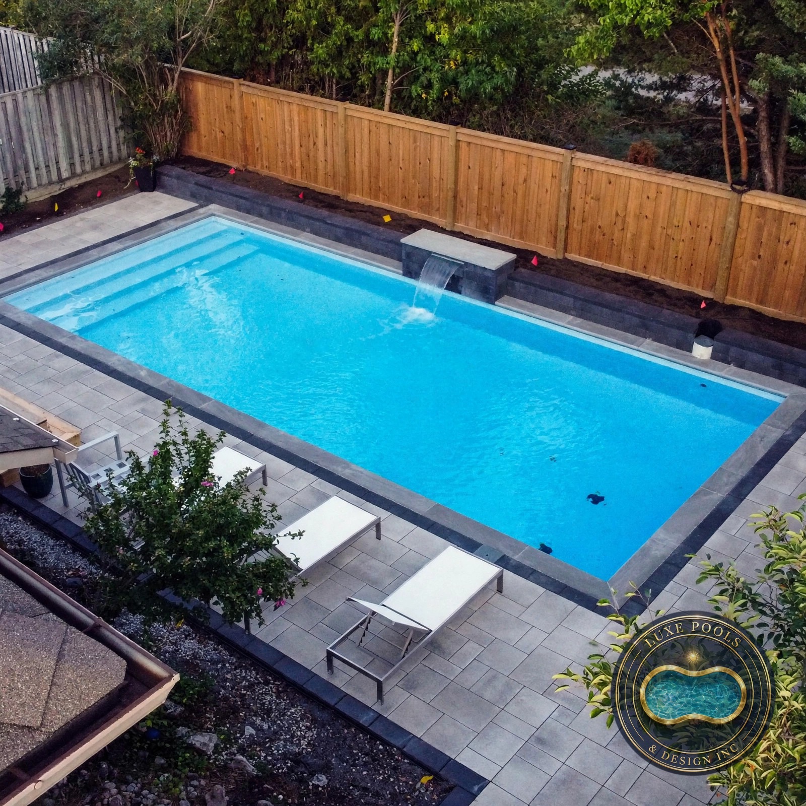 Fibreglass pool with patio in an Oakville backyard